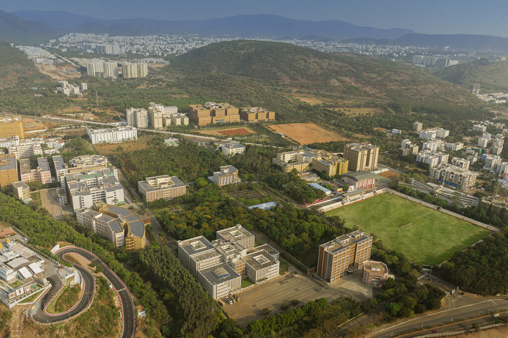 Aerial view of the GITAM University campus with academic blocks, hostels and sports grounds, from the GITAM brand film shoot.