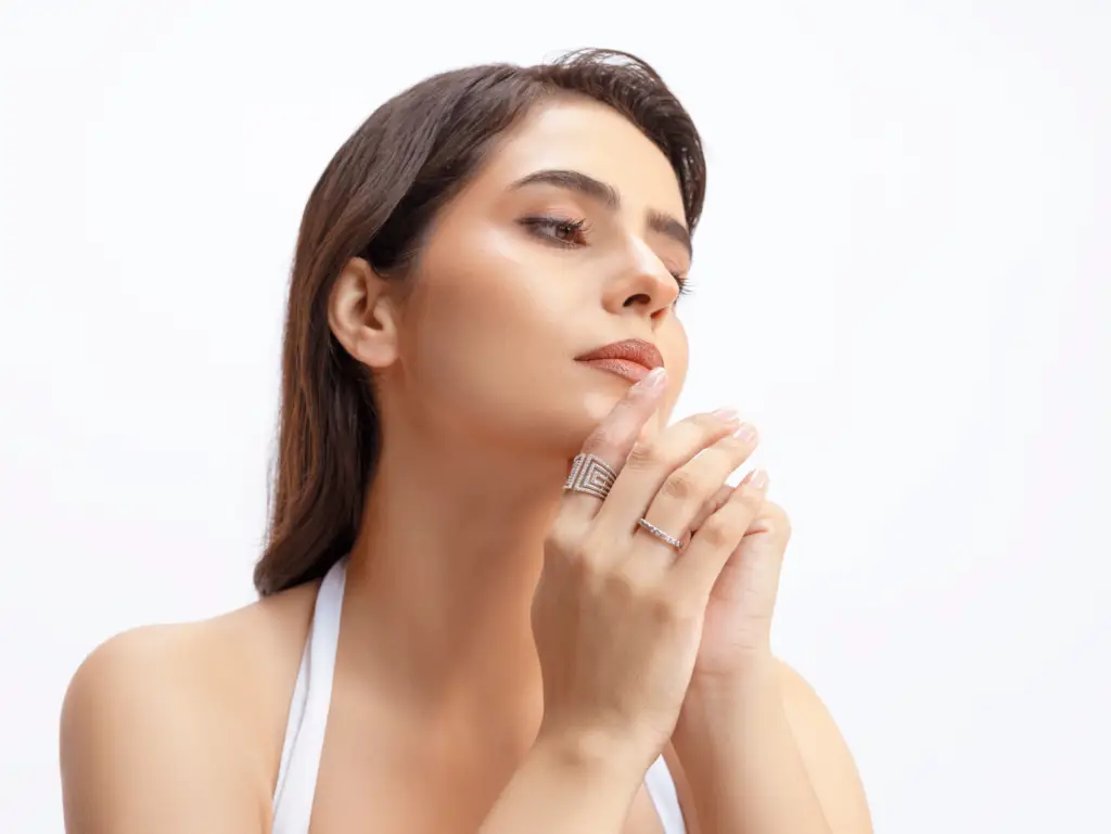 Glain Lifestyle lifestyle photograph: a model wearing silver rings and jewellery against a white backdrop.